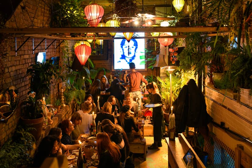 Hanging Garden Room dining space with greenery, ideal for casual gatherings and events.