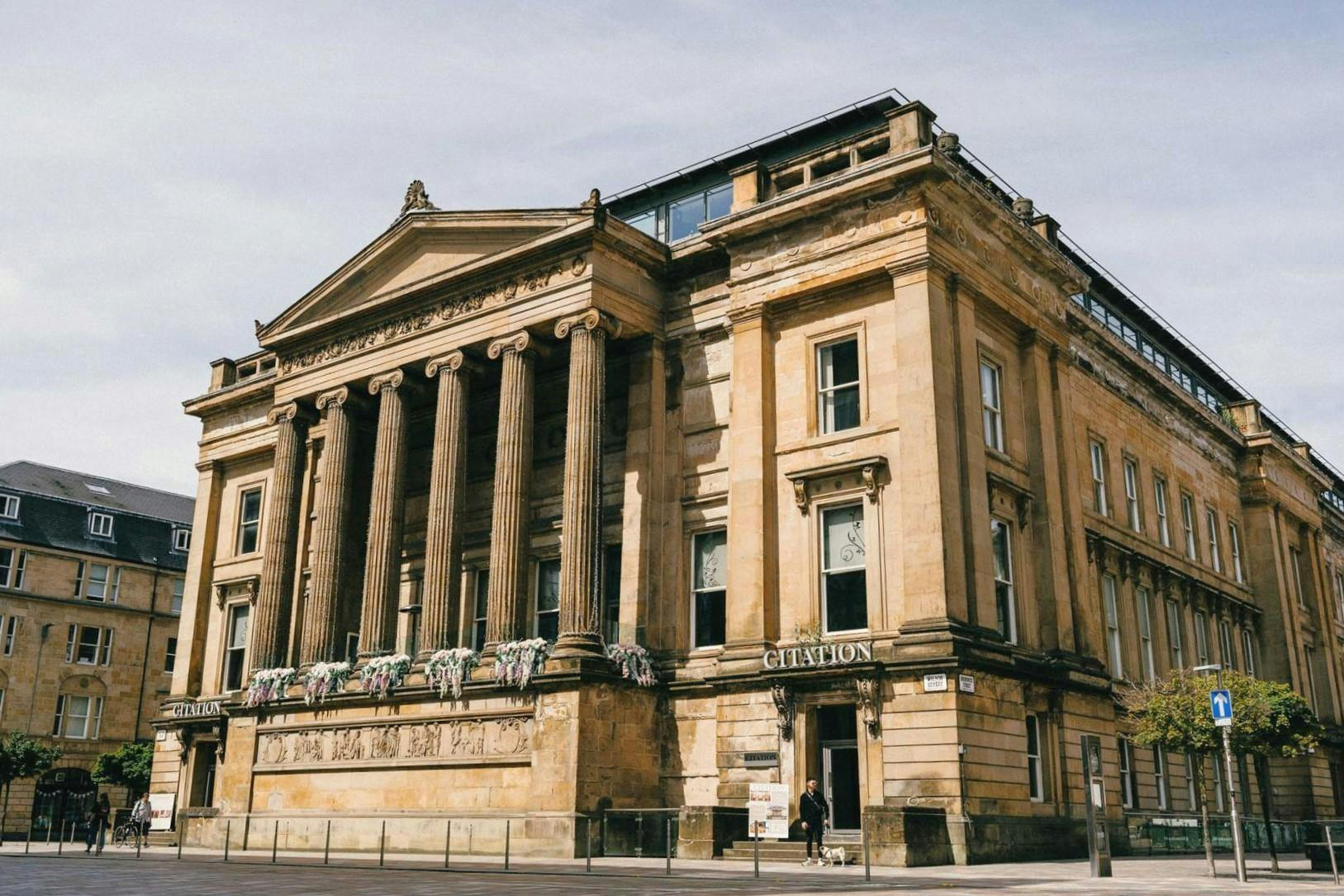 Grand historic venue in Glasgow with elegant columns, perfect for upscale events.