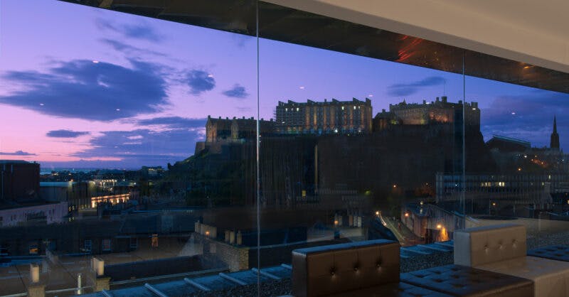 SKYBar at DoubleTree Edinburgh with sunset view of Edinburgh Castle, ideal for events.