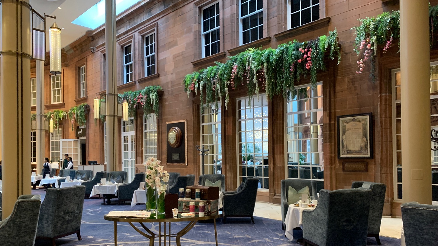 Peacock Alley at Waldorf Astoria Edinburgh, elegant event space with lush greenery. - Banner