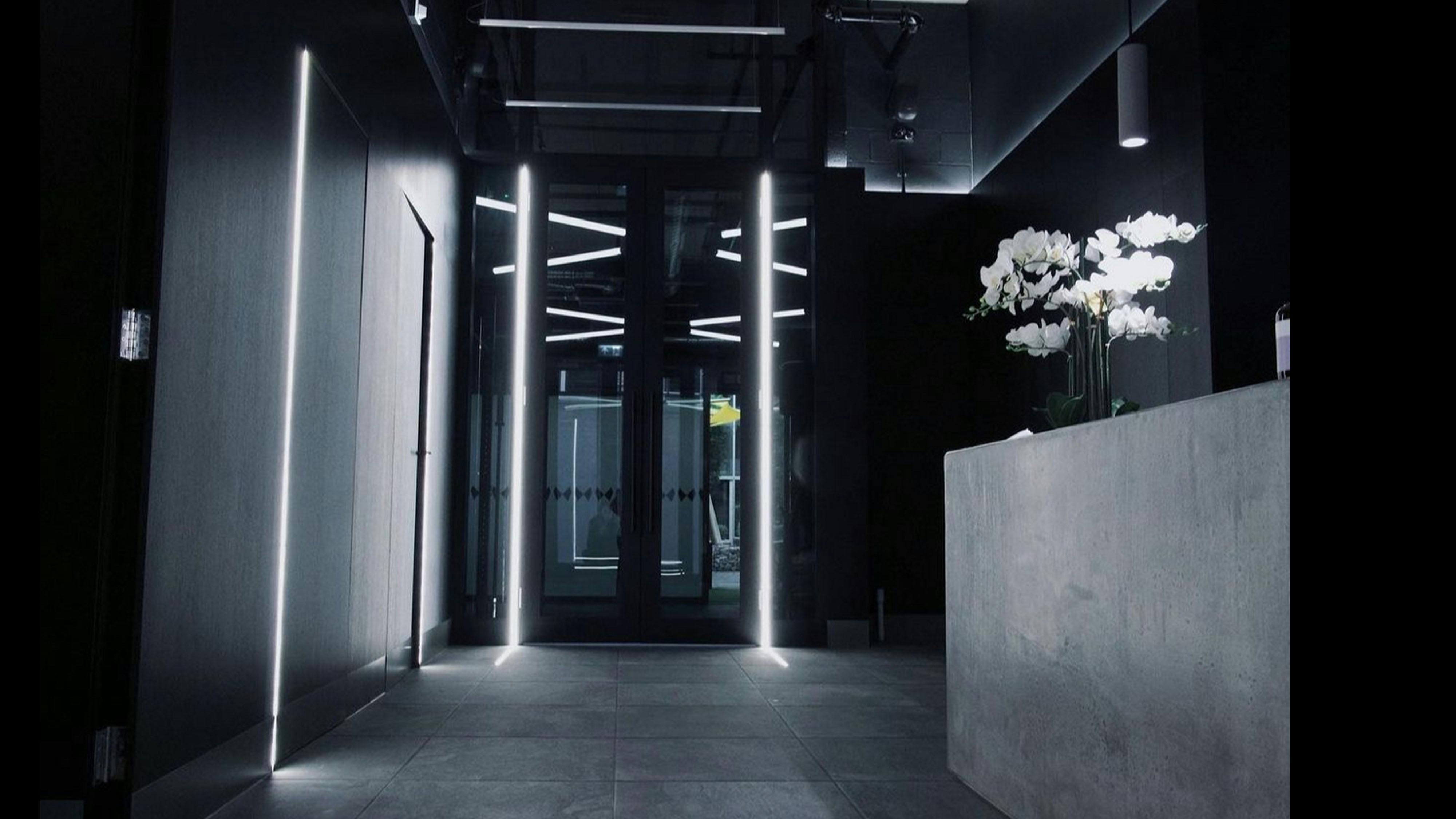 Modern fitness center entrance with elegant decor for upscale events and corporate functions.