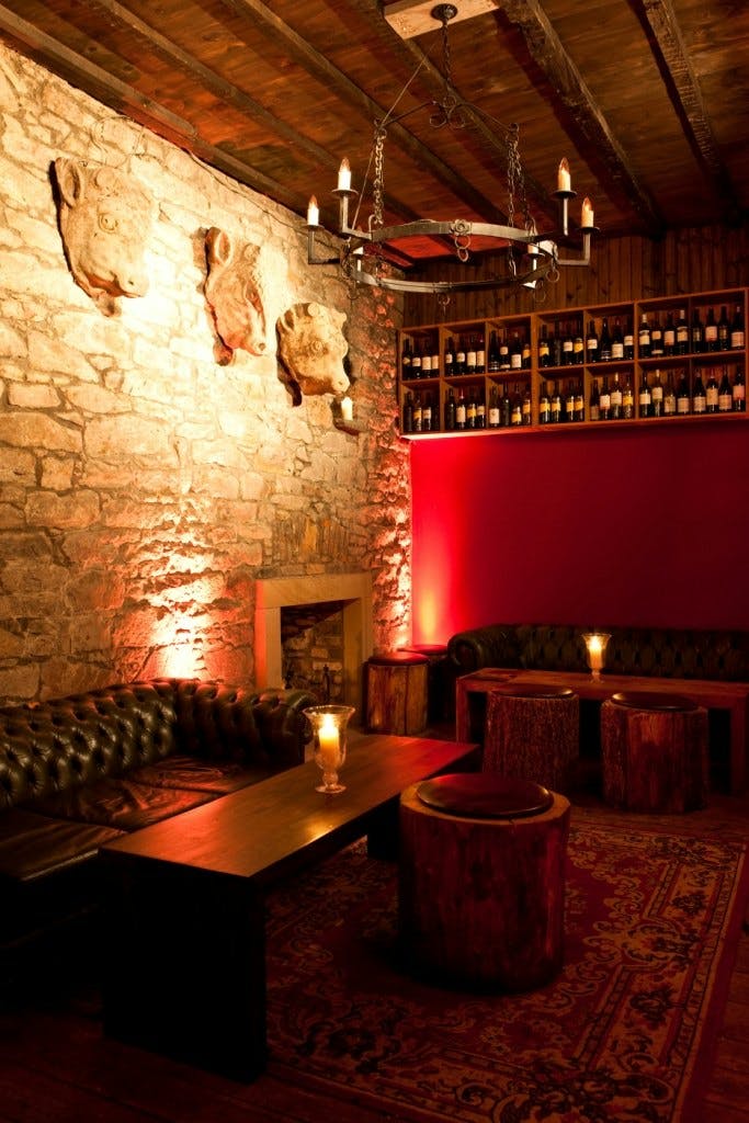 Cozy rustic venue with stone walls for intimate gatherings and wine tastings.