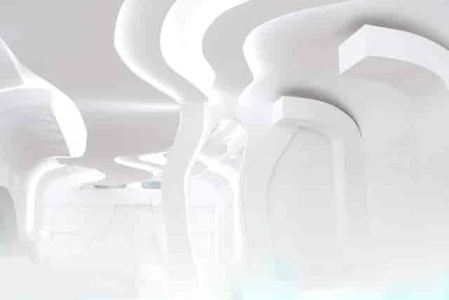 Modern minimalist event space with fluid lines, perfect for meetings and gatherings.