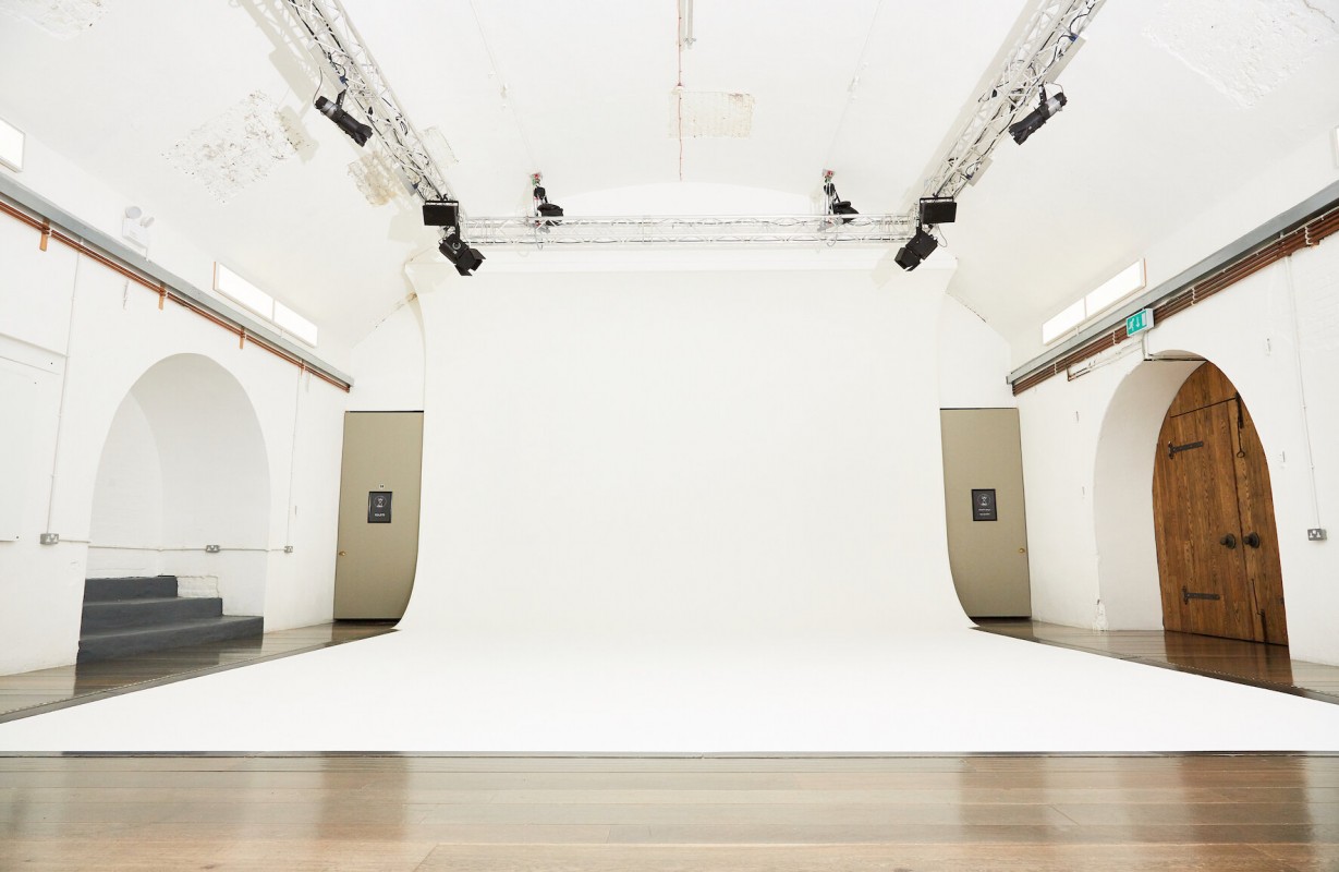 White Rabbit Cafe event space with bright white backdrop, ideal for workshops and photo shoots. - Banner