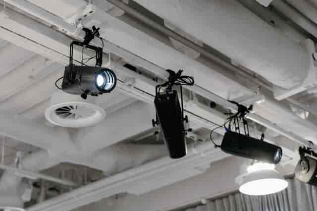 Broadwick Studio Main Space with industrial rigging and theatrical lighting for event hire.