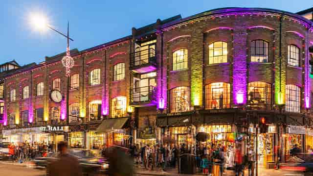 Vibrant Screening Room in W London, historic brick facade, ideal for events and networking.