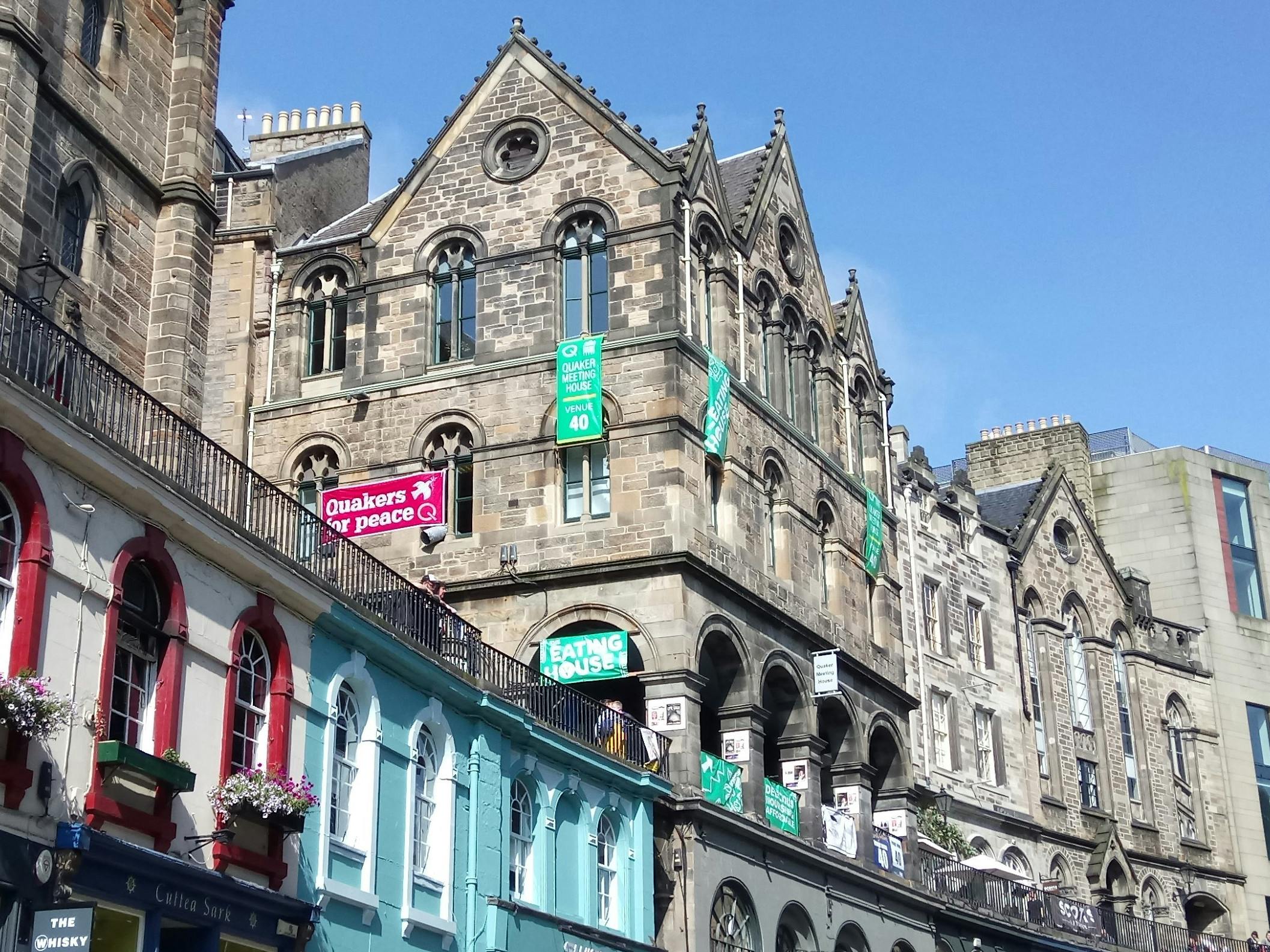 Edinburgh Quaker Meeting House Hall, vibrant street scene for outdoor events and festivals.