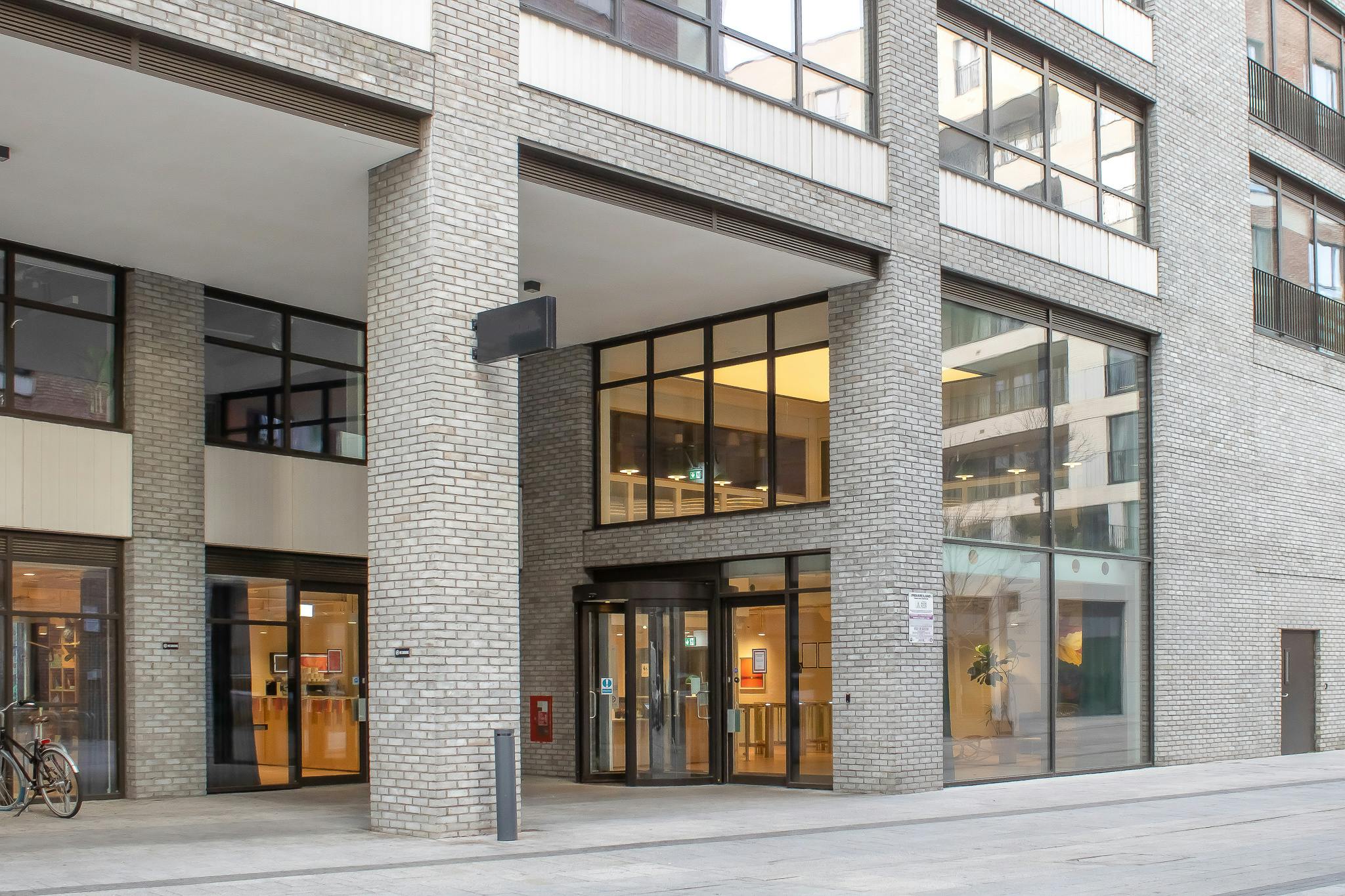Modern Shoreditch Exchange boardroom with glass doors, ideal for meetings and events.