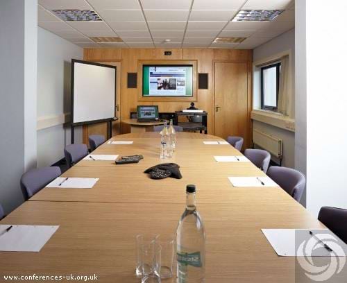 IT Training Suite at Carnegie Conference Centre with long table, ideal for professional meetings. - Banner