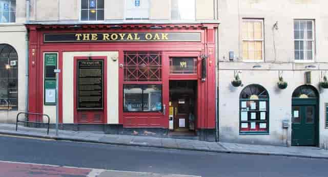 Charming red pub exterior at Basement Lounge, ideal for networking events in Royal Oak.