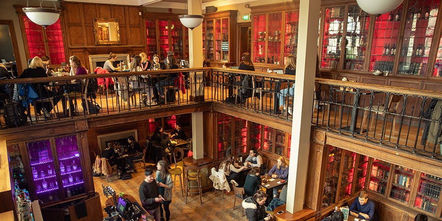 University of Edinburgh library venue with warm lighting for networking events and gatherings.