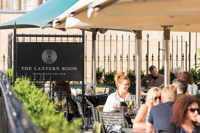 Outdoor dining space at The Lantern Room with stylish seating, perfect for networking events.
