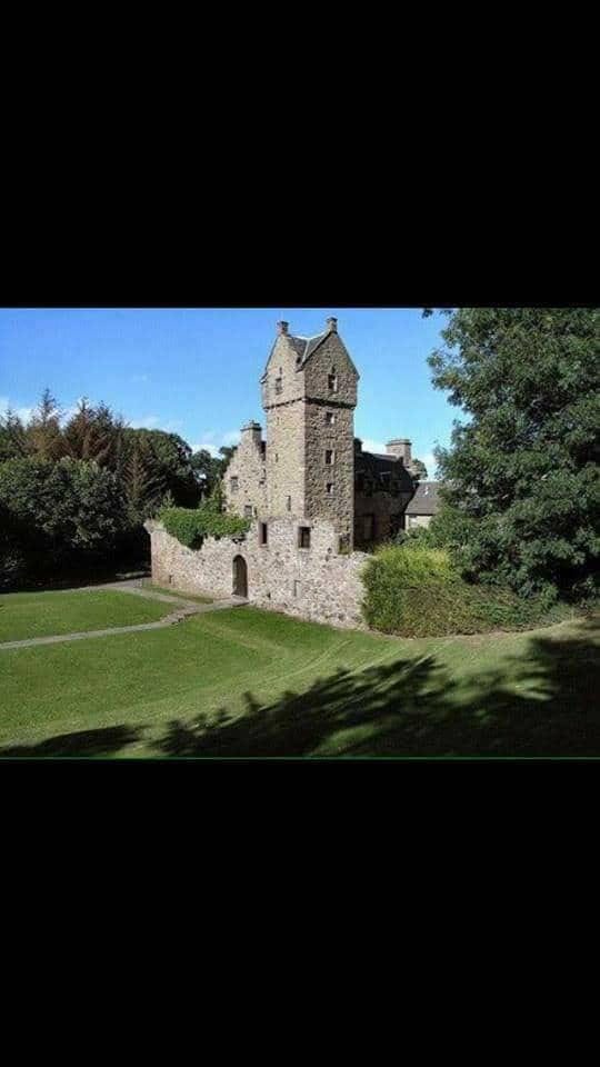 Mains Castle courtyard: charming stone venue for weddings and corporate events.