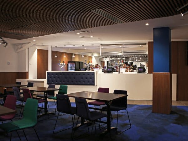 Centenary Club event space with sleek bar, ideal for networking and gatherings.