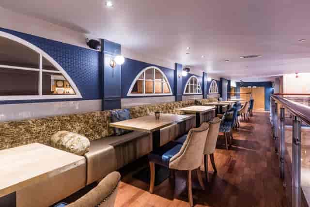Bothy mezzanine at Brewhemia: upscale booth seating for corporate networking and private events.