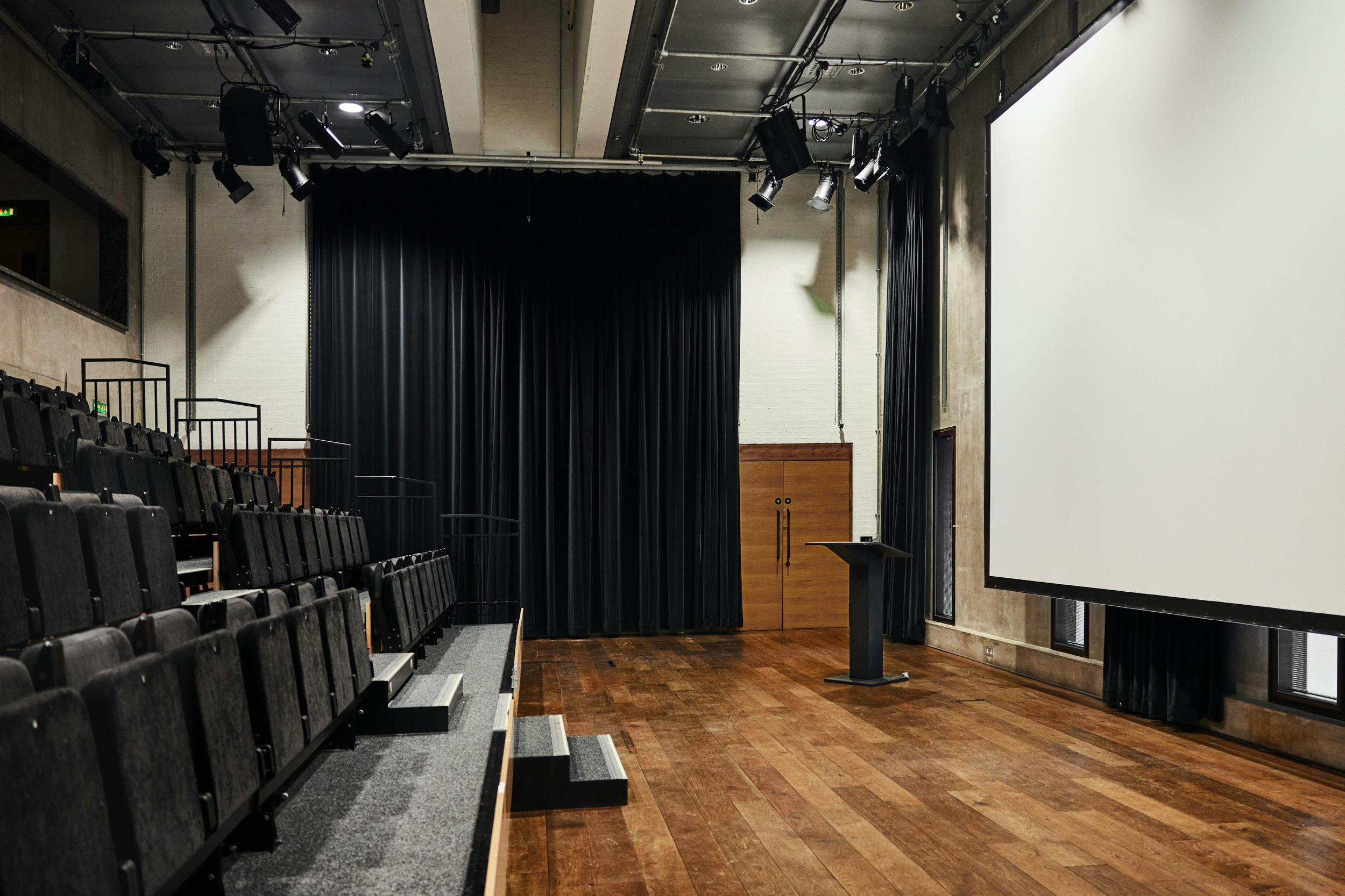 Versatile event space with tiered seating for conferences and workshops at The Bluecoat.