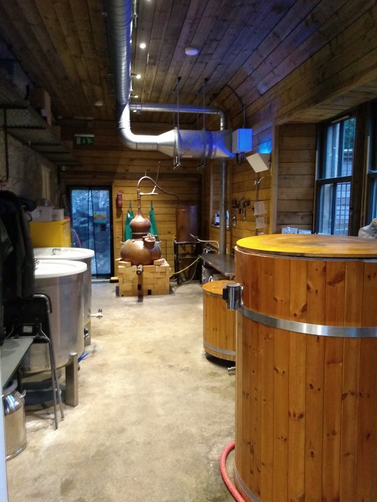 Rustic distillery interior at The Cotton Sheds for corporate retreats and team-building events.