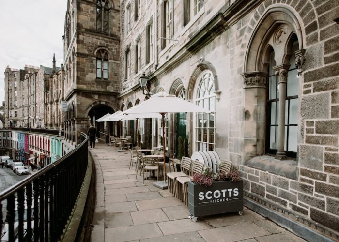 Charming outdoor terrace at Scotts Kitchen, perfect for events with stylish seating and views. - Banner