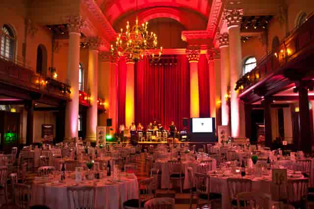 Elegant banquet hall with chandeliers for live music events and corporate gatherings.