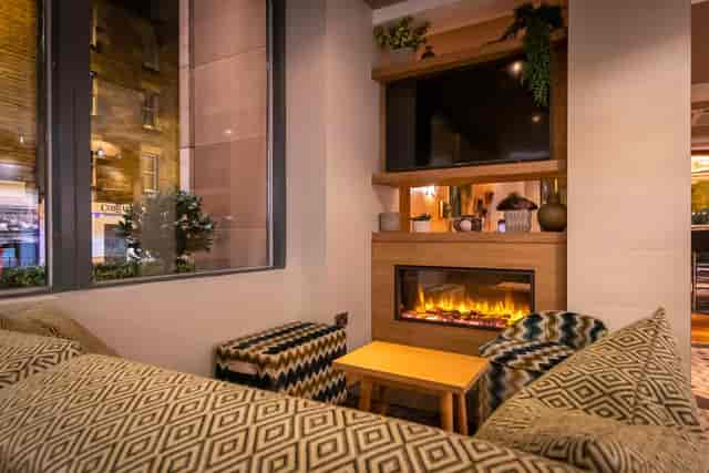 Cozy lounge at Point A Hotel Edinburgh, perfect for networking events and meetings.