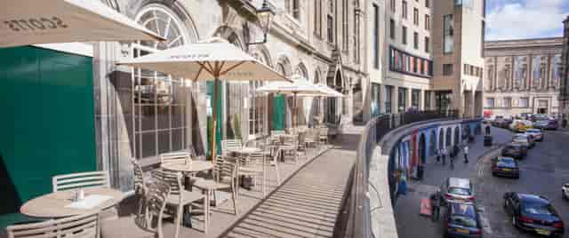 Outdoor seating at Howies Restaurants, perfect for casual meetings and networking events.