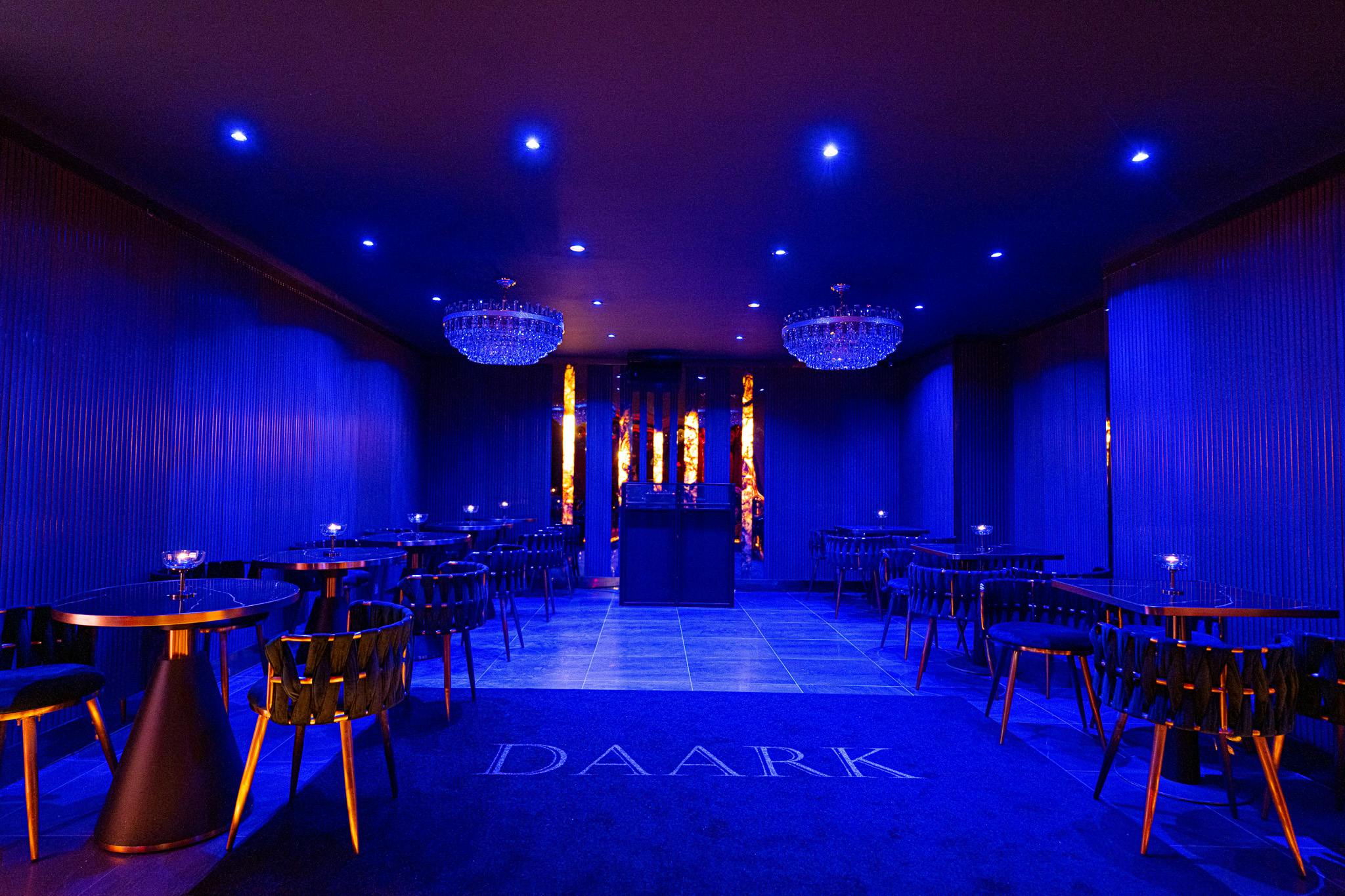 Sleek modern event space with blue ambiance, ideal for corporate functions and upscale events.