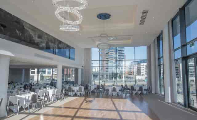 Modern event space at The Bow, Harbour Hotel Southampton with large windows and chandeliers.