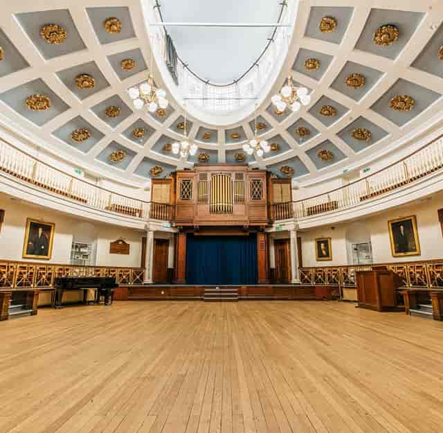 Elegant auditorium with grand stage, ideal for conferences and performances.