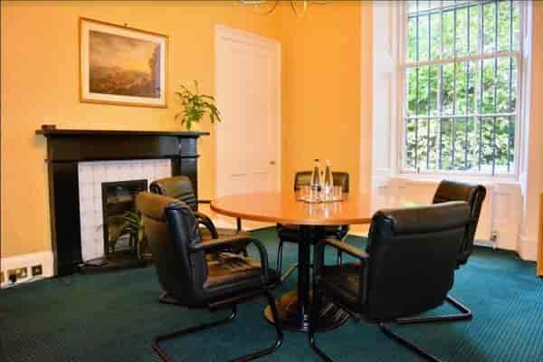 Meeting room in Inigo Edinburgh with round table, ideal for team meetings and consultations.