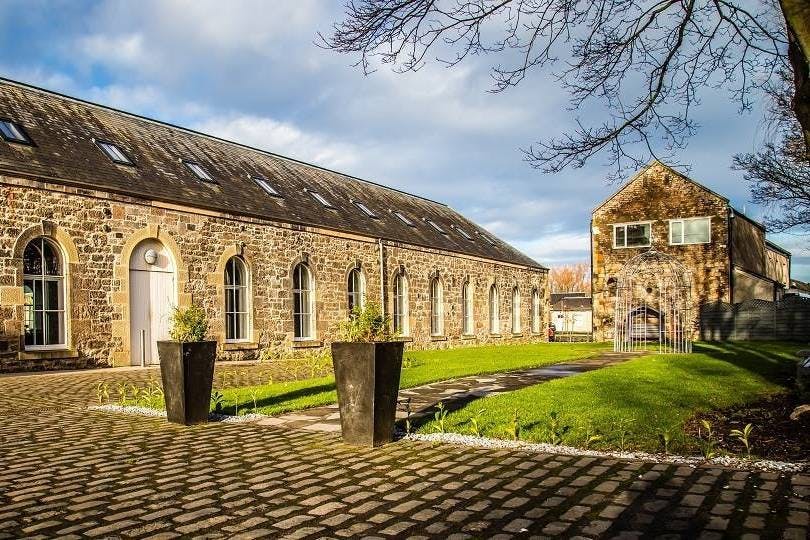 Cotton Sheds Eskmills Venue with rustic stone architecture for events and receptions.