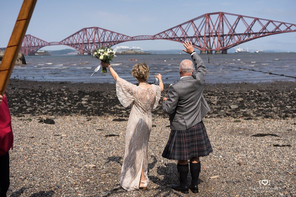 Outdoor wedding at Orocco Pier with Forth Bridge backdrop, ideal for memorable events.