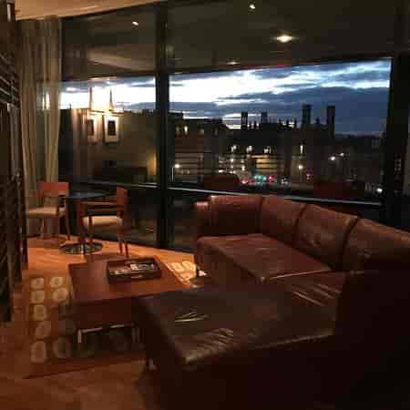 Snug Bar lounge at The Glasshouse: VIP event space with panoramic city views for executive networking.