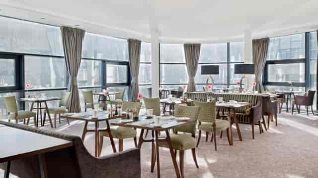 Snug Bar at The Glasshouse with floor-to-ceiling windows for networking lunches and workshops.