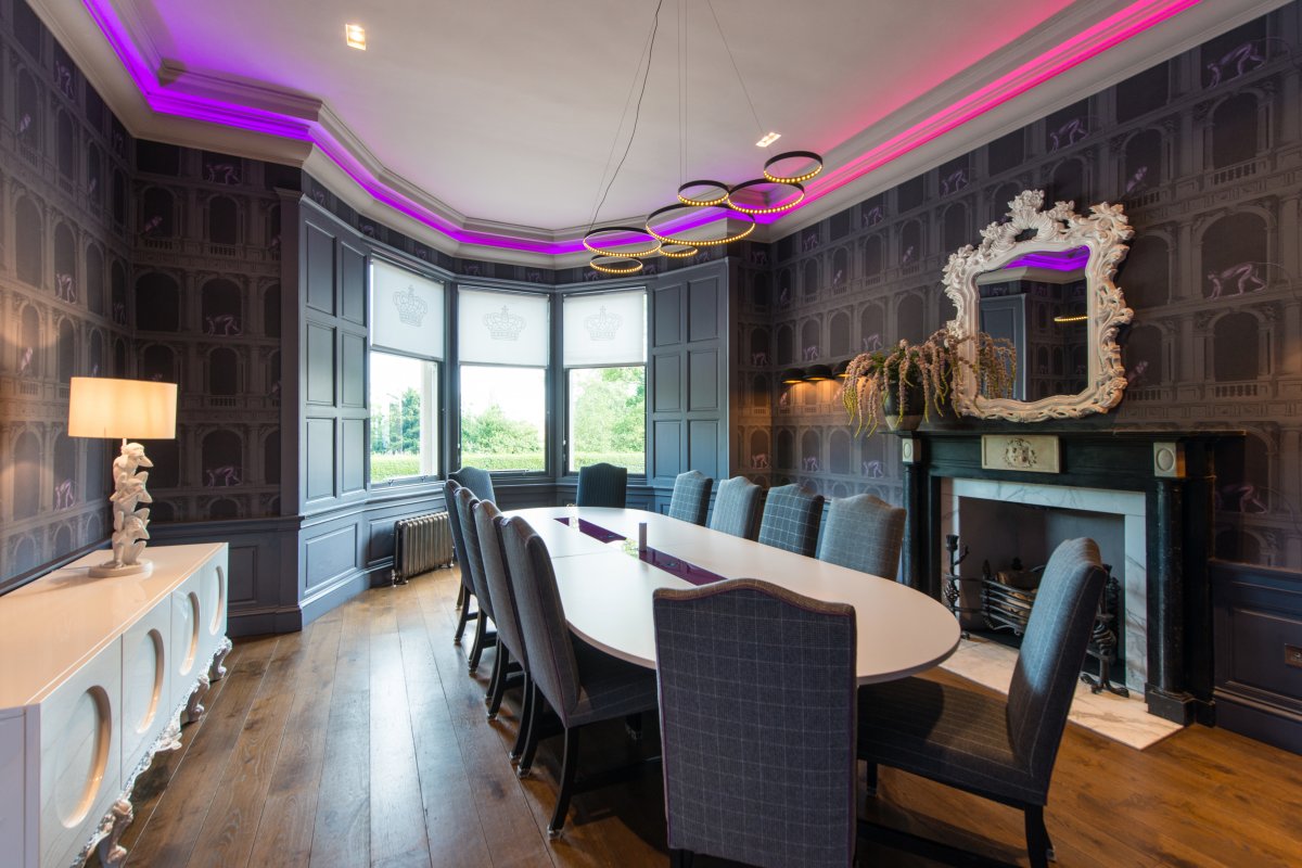 Stylish meeting room at The Archives, featuring an elongated table and modern lighting. - Banner