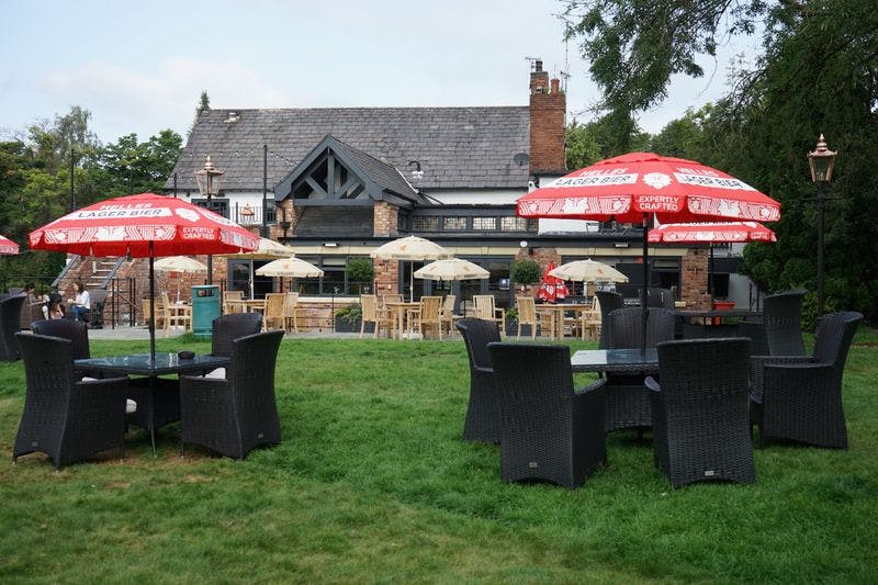 Charming Beer Garden with vibrant umbrellas, ideal for summer parties and networking events.