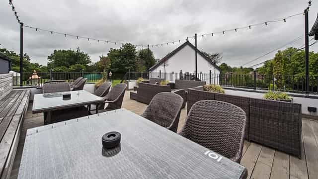 Beer Garden in Bulls Head with wicker furniture, ideal for casual gatherings and events.