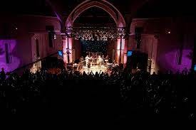 Vibrant Rock Tower event space with dynamic lighting for concerts and corporate gatherings.