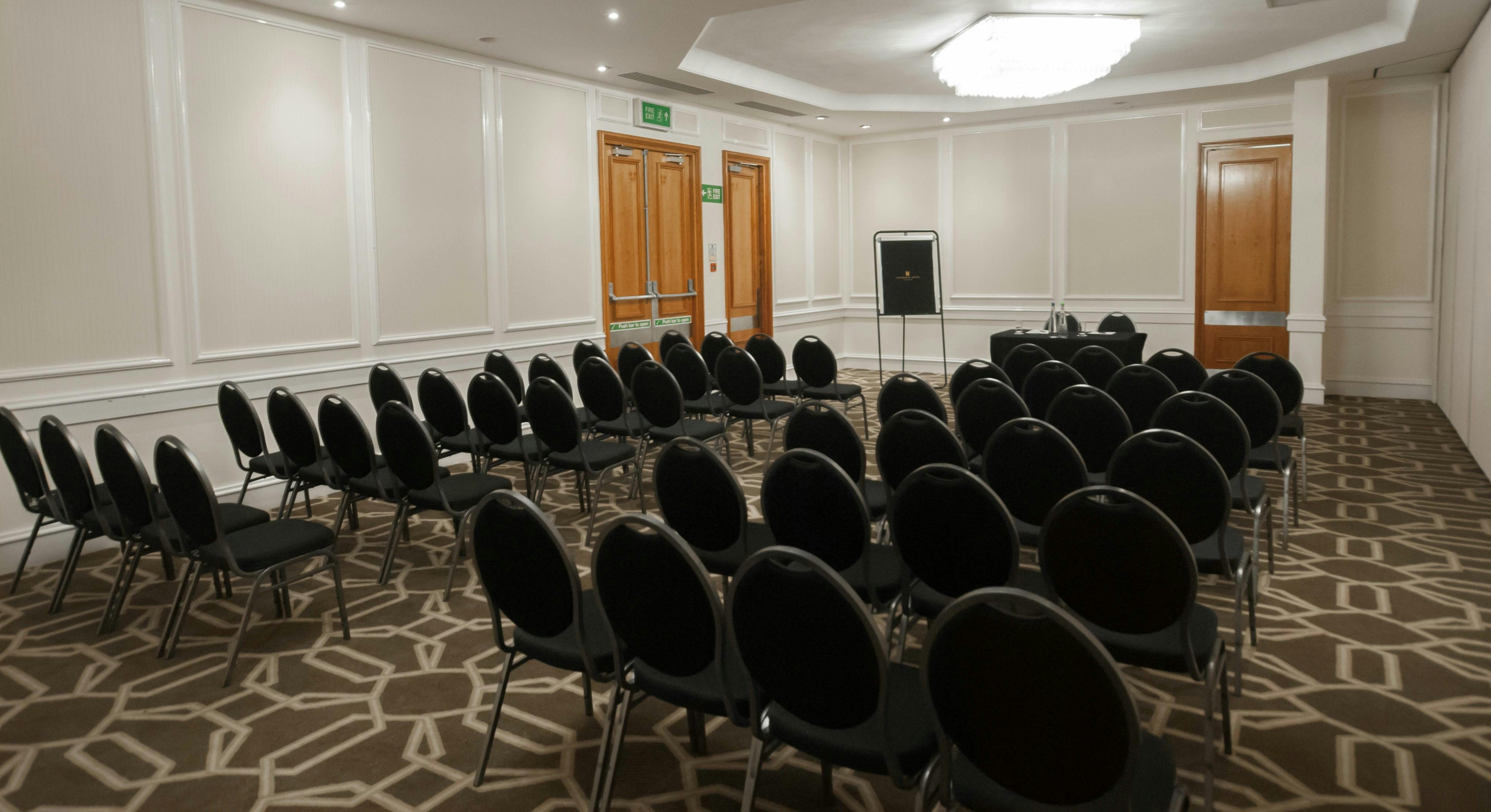 McCallum Suite meeting room with circular chairs, ideal for workshops and presentations.