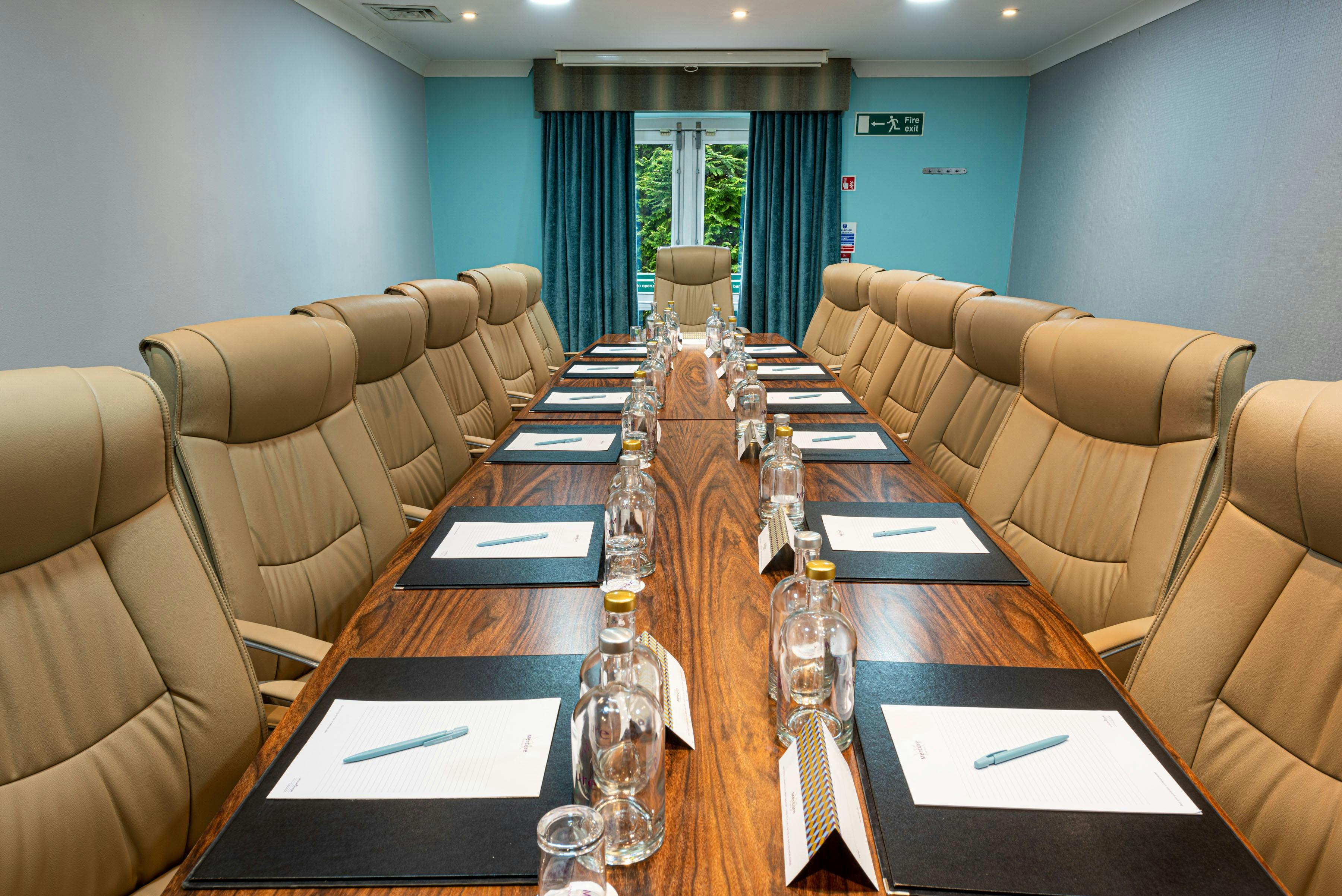 Hopwood Suite meeting room with polished table, ideal for corporate events and workshops.