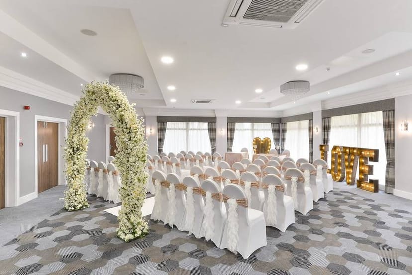 Hopwood Suite wedding venue with floral arch and elegant decor in Manchester.
