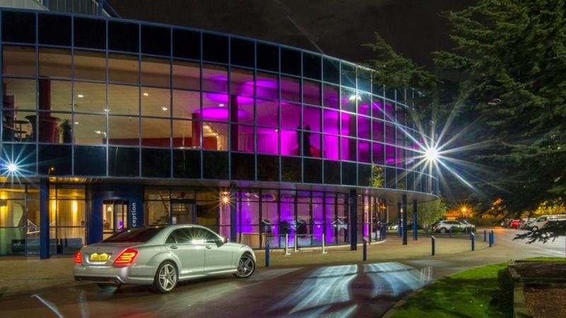 Christchurch Suite at Kassam Stadium, modern venue with purple lighting for events.