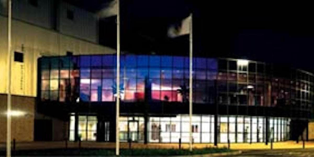 Modern Kassam Stadium Exhibition Hall at night, ideal for conferences and galas.