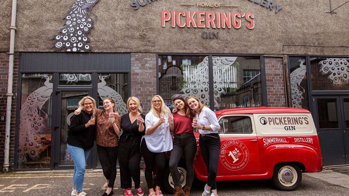 Vibrant team outside Pickering's Gin distillery, ideal for corporate events and celebrations.