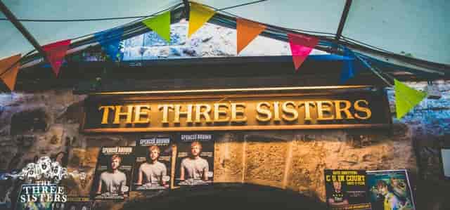 Vibrant courtyard at The Three Sisters Bar, perfect for lively social events and gatherings.