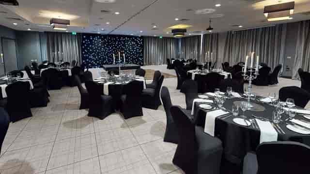 Elegant meeting room with candelabras, ideal for corporate events and celebrations.