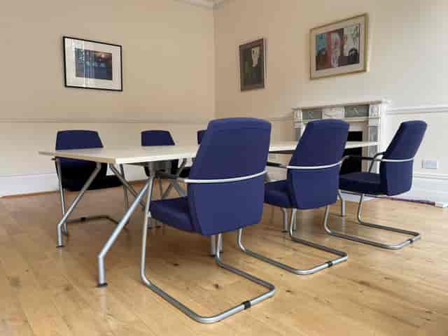 Modern meeting room with ergonomic chairs in historic Bloomsbury building, ideal for gatherings.