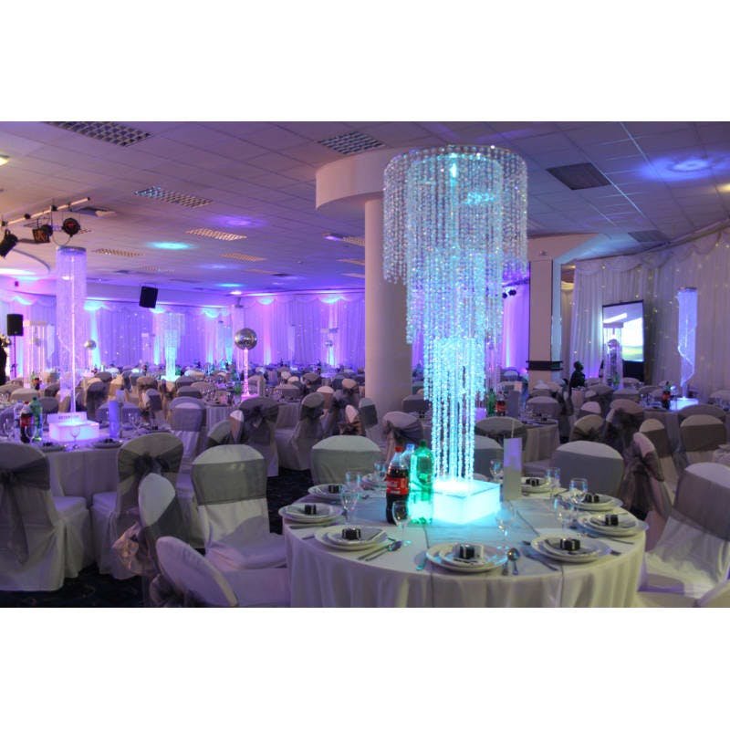 Elegant exhibition venue with crystal centerpiece, perfect for weddings and upscale events.