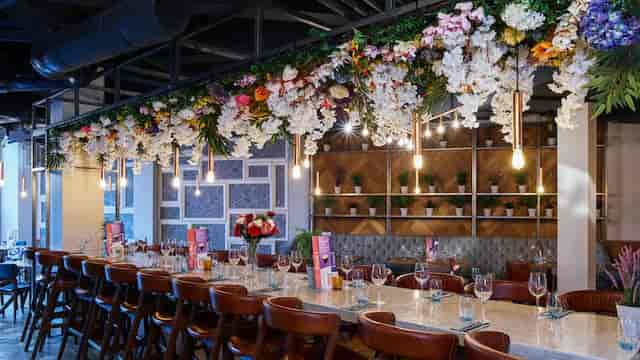 Banyan Corn Exchange event space with hanging floral lighting for weddings and corporate meetings.