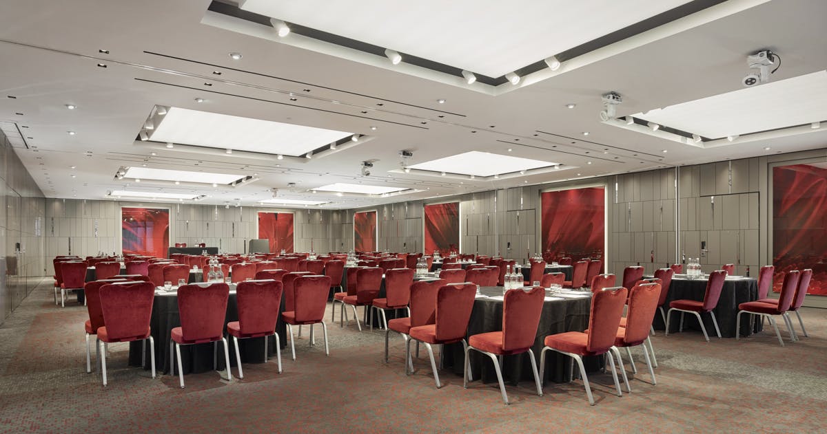 Event space at City Suites, Park Plaza London Riverbank, with elegant red chairs.