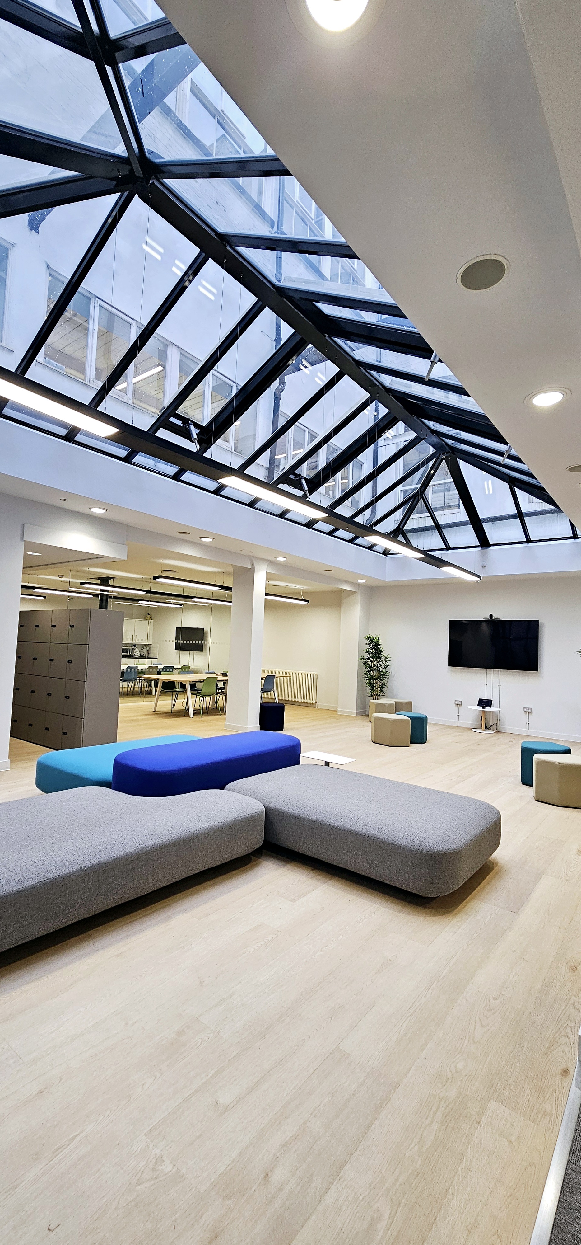 Modern event space in ZEBOX UK with skylight, ideal for meetings and gatherings. - Banner